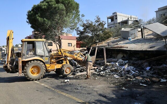 Heavy machinery is used to remove rubble from a site targeted overnight by an Israeli airstrike in the southern Lebanese village of Et Taybeh on November 7, 2025. (Rabih Daher/AFP)