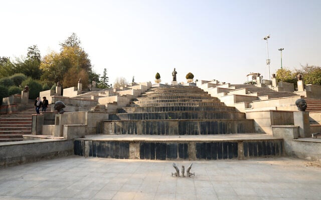A dry water feature collects dust in a Mellat Park, as the Iran faces sever water shortages, in Tehran on November 9, 2025 (ATTA KENARE / AFP)