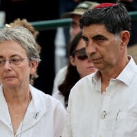 Leah Goldin (L) and Simcha Goldin, the parents of IDF Lt. Hadar Goldin, who was killed in 2014 in Gaza, look on at his funeral in a military cemetery in Kfar Saba on November 11, 2025. (Abir SULTAN / POOL / AFP)
