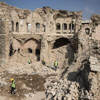 Workers start the rehabilitation on what remains of the Pasha Palace Museum, damaged by two years of fighting between Israel and Hamas, in Gaza City on November 11, 2025. (Omar al-Qataa/AFP)