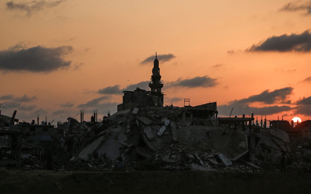 A minaret is pictured amongst destroyed buildings in Nuseirat, Gaza Strip on November 11, 2025. (Eyad Baba / AFP) A minaret is pictured amongst destroyed buildings in Nuseirat, Gaza Strip on November 11, 2025. (Eyad Baba / AFP)