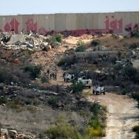 Troops from the United Nations Interim Force in Lebanon (UNIFIL) patrol near the southern Lebanese border village of Kfar Kila on November 12, 2025. (Rabih DAHER / AFP)