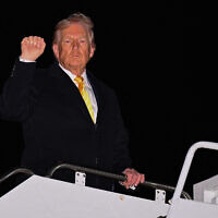 US President Donald Trump boards Air Force One on November 14, 2025, at Joint Base Andrew, Maryland. (Roberto Schmidt/Getty Images/AFP)