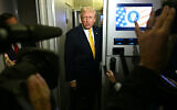 US President Donald Trump speaks to reporters aboard Air Force One en route to Palm Beach, Florida, on November 14, 2025 (Jim WATSON / AFP)
