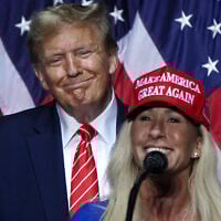 US Rep. Marjorie Taylor Greene, Republican of Georgia, right, speaks alongside then-presidential hopeful, US President Donald Trump, at a campaign event in Rome, Georgia, on March 9, 2024. (Elijah Nouvelage / AFP)