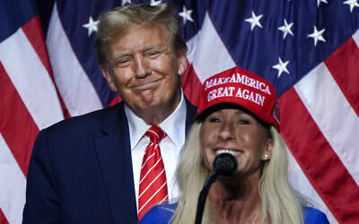 US Rep. Marjorie Taylor Greene, Republican of Georgia, right, speaks alongside then-presidential hopeful, US President Donald Trump, at a campaign event in Rome, Georgia, on March 9, 2024. (Elijah Nouvelage / AFP)