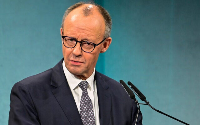 German Chancellor Friedrich Merz delivers the opening speech at an economic summit hosted by German newspaper Süddeutsche Zeitung at the Adlon Hotel  in Berlin on November 17, 2025. (Tobias SCHWARZ / AFP)