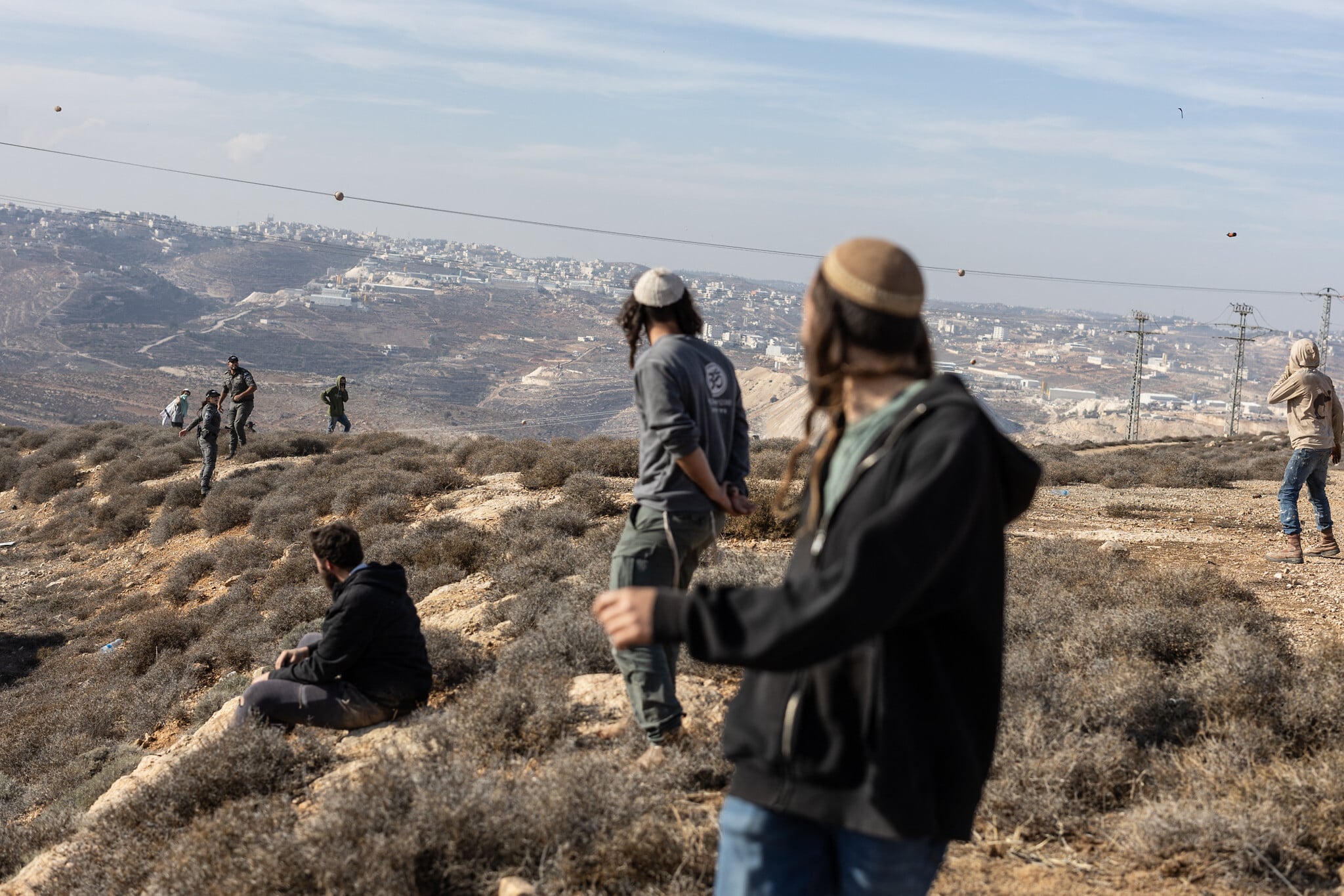 Dozens of masked Israelis riot, hurl stones after illegal West Bank outpost evacuated