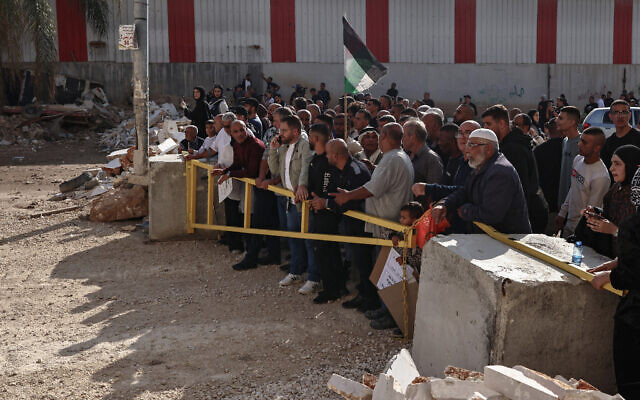 Residents of the Nur Shams refugee camp, near Tulkarem in the West Bank, gather at the entrance of the camp during a protest on November 18, 2025. (Zain JAAFAR / AFP)