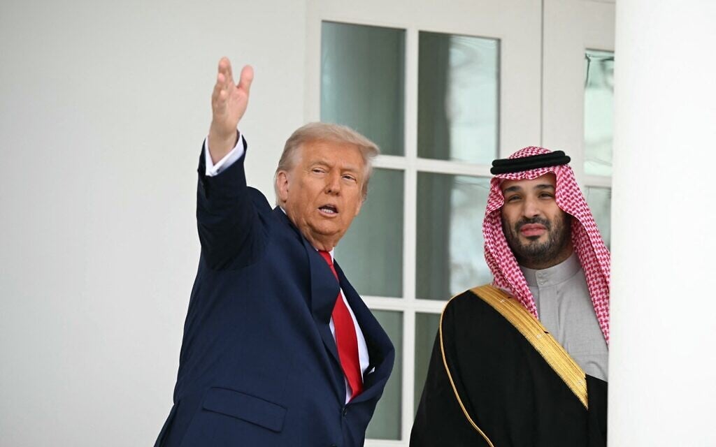US President Donald Trump and Crown Prince of Saudi Arabia Mohammed bin Salman walk down the Colonnade on the way to the Oval Office of the White House in Washington, DC on November 18, 2025. (ANDREW CABALLERO-REYNOLDS / AFP)