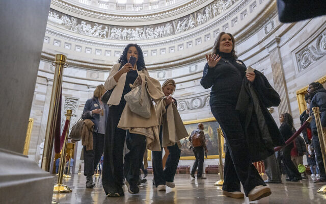 Survivors of abuse by Jeffrey Epstein walk through the US Capitol rotunda ahead of a vote the "Epstein Files Transparency Act" in Washington, DC on November 18, 2025. (DANIEL HEUER / AFP)