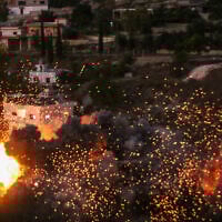Flames and smoke erupt from the site of an Israeli strike on the southern Lebanese village of Tair Filsay on November 19, 2025. (Muhammad Zanaty / AFP)