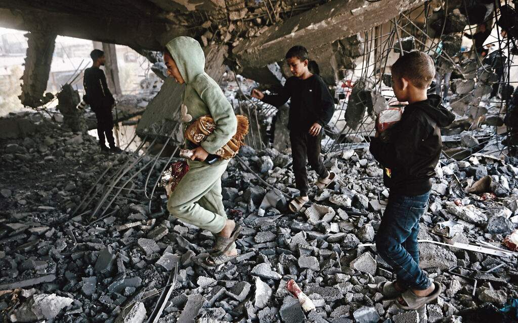 Palestinian children inspect the debris of a damaged building belonging to the Hamas-run Ministry of Religious Endowments, which was sheltering displaced people in the Zeitoun neighborhood of Gaza City on November 20, 2025, a day after it was targeted by the Israeli military. (Omar Al-Qattaa/AFP) Palestinian children inspect the debris of a damaged building belonging to the Hamas-run Ministry of Religious Endowments, which was sheltering displaced people in the Zeitoun neighborhood of Gaza City on November 20, 2025, a day after it was targeted by the Israeli military. (Omar Al-Qattaa/AFP)