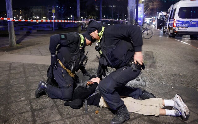 Police apprehend a suspect at the scene where a person was stabbed near the memorial of the murdered Jews of Europe in Berlin on February 21, 2025. (Odd ANDERSEN / AFP) Police apprehend a suspect at the scene where a person was stabbed near the memorial of the murdered Jews of Europe in Berlin on February 21, 2025. (Odd ANDERSEN / AFP)