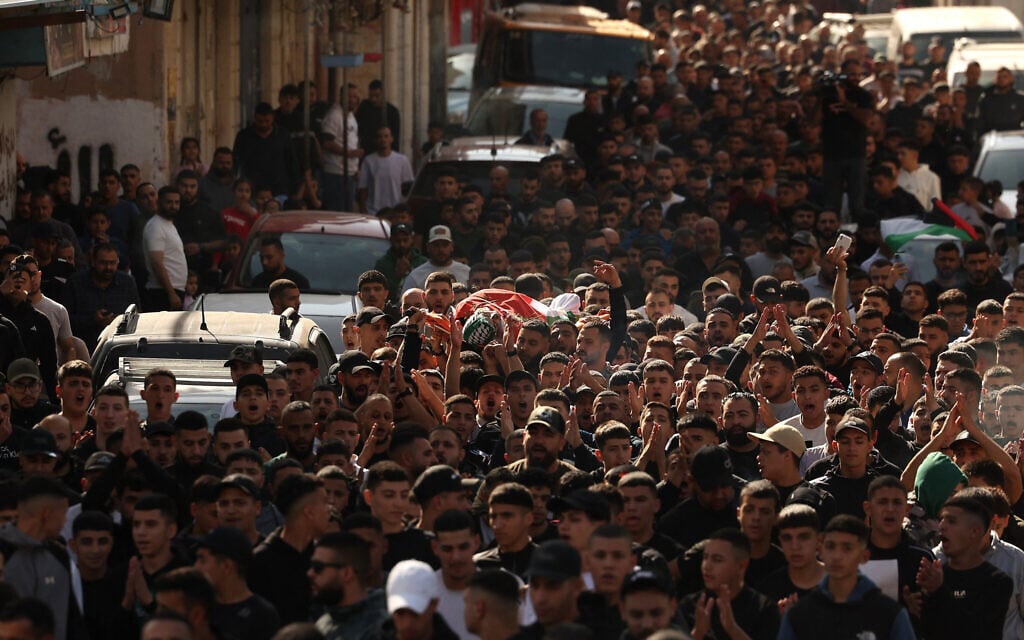 Mourners carry the body of 18-year-old Palestinian Amr Khaled Ahmed al-Marbou, who was killed by Israeli forces, during his funeral in Al-Amari refugee camp near the city of Ramallah in the West Bank on November 21, 2025. (Ahmad GHARABLI / AFP) Mourners carry the body of 18-year-old Palestinian Amr Khaled Ahmed al-Marbou, who was killed by Israeli forces, during his funeral in Al-Amari refugee camp near the city of Ramallah in the West Bank on November 21, 2025. (Ahmad GHARABLI / AFP)