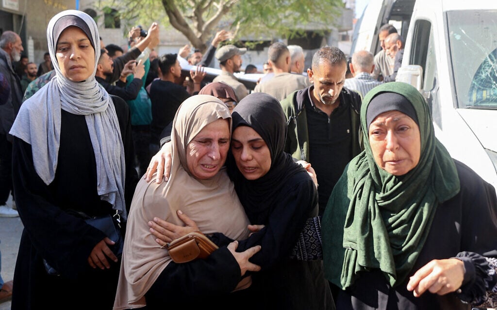 Mourners react as they attend the funeral of Palestinians who killed the day before by Israeli strikes, in Gaza City's Al-Shifa Hospital, on November 23, 2025. (Photo by Omar AL-QATTAA / AFP) Mourners react as they attend the funeral of Palestinians who killed the day before by Israeli strikes, in Gaza City's Al-Shifa Hospital, on November 23, 2025. (Photo by Omar AL-QATTAA / AFP)