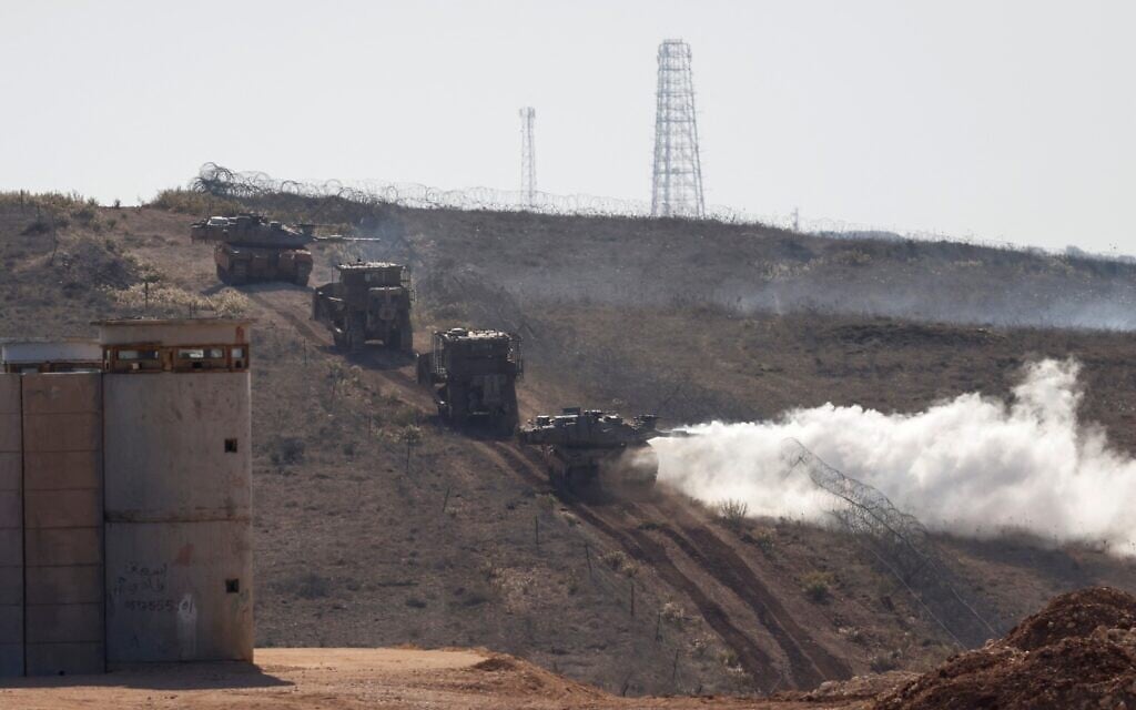Israeli military vehicles patrol close to the border fence separating northern Israel from southern Lebanon on November 23, 2025. (Photo by Jalaa MAREY / AFP) Israeli military vehicles patrol close to the border fence separating northern Israel from southern Lebanon on November 23, 2025. (Photo by Jalaa MAREY / AFP)