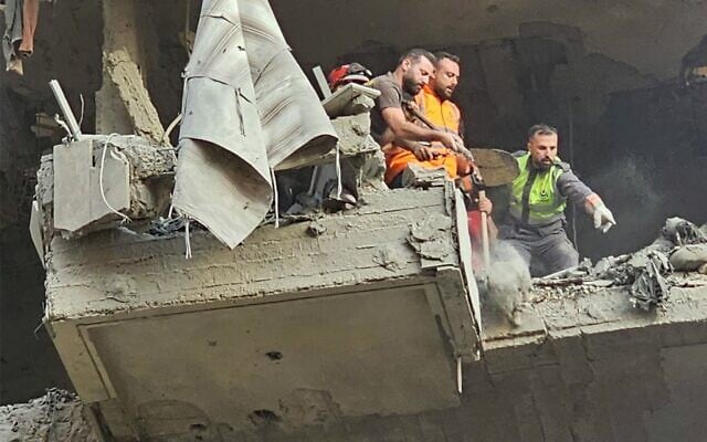 Rescuers search for survivors at the site of an Israeli airstrike on an apartment building in the southern suburb of Beirut, on November 23, 2025. (AFP) Rescuers search for survivors at the site of an Israeli airstrike on an apartment building in the southern suburb of Beirut, on November 23, 2025. (AFP)