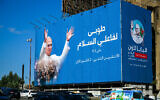 Motorists drive past a billboard displaying a picture of Pope Leo XIV in Beirut on November 26, 2025. (Joseph EID / AFP)