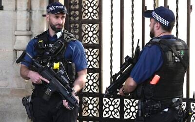 Police officers stand guard outside the Houses of Parliament in London in 2023. (AP Photo/Kin Cheung) Police officers stand guard outside the Houses of Parliament in London in 2023. (AP Photo/Kin Cheung)
