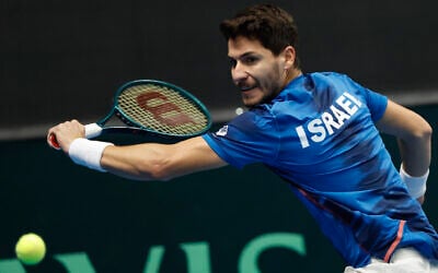 Israel's Yishai Oliel returns the ball to Germany's Maximilian Marterer of during a Davis Cup qualifier tennis match between Israel and Germany in Vilnius, Lithuania, January 31, 2025. (AP Photo/Mindaugas Kulbis)
