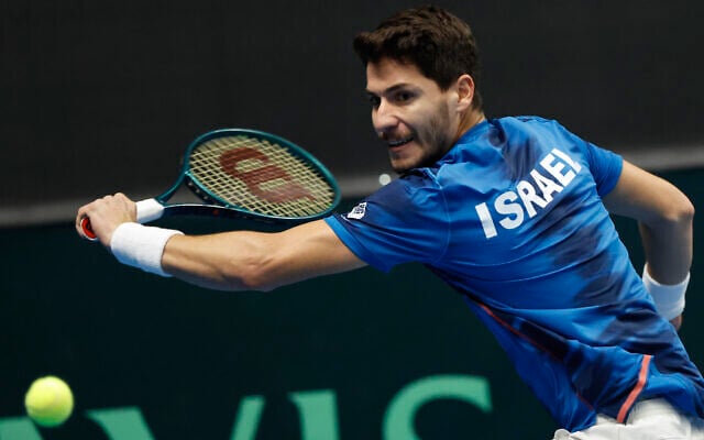 Israel's Yishai Oliel returns the ball to Germany's Maximilian Marterer of during a Davis Cup qualifier tennis match between Israel and Germany in Vilnius, Lithuania, January 31, 2025. (AP Photo/Mindaugas Kulbis) Israel's Yishai Oliel returns the ball to Germany's Maximilian Marterer of during a Davis Cup qualifier tennis match between Israel and Germany in Vilnius, Lithuania, January 31, 2025. (AP Photo/Mindaugas Kulbis)