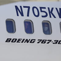 Illustrative: Venezuelan migrants deported from the United States peer through windows of an Eastern Airlines plane upon arriving at Simon Bolivar International Airport in Maiquetia, Venezuela, Sunday, March 30, 2025. (AP Photo/Cristian Hernandez)