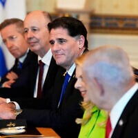 Prime Minister Benjamin Netanyahu, from right, attends a meeting with President Donald Trump, not pictured, as Netanyahu's wife Sara Netanyahu, Israel's Strategic Affairs Minister Ron Dermer, Israel's National Security Adviser Tzachi Hanegbi and Israel's Cabinet Secretary Yossi Fuchs listen in the Blue Room of the White House, Monday, July 7, 2025, in Washington. (AP Photo/Alex Brandon)