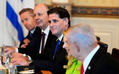 Prime Minister Benjamin Netanyahu, from right, attends a meeting with US President Donald Trump, not pictured, as Netanyahu's wife Sara Netanyahu, Strategic Affairs Minister Ron Dermer, National Security Adviser Tzachi Hanegbi and Cabinet Secretary Yossi Fuchs listen, in the Blue Room of the White House, July 7, 2025, in Washington. (AP/Alex Brandon)