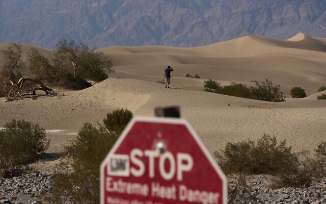 A person walks on sand dunes on August 3, 2025, in Death Valley National Park, California. (AP Photo/John Locher) A person walks on sand dunes on August 3, 2025, in Death Valley National Park, California. (AP Photo/John Locher)