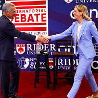 FILE - Republican candidate Jack Ciattarelli, left, shake hands with Democratic candidate for governor Mikie Sherrill, right, before a New Jersey gubernatorial debate, September 21, 2025, in Lawrenceville, New Jersey. (AP Photo/Noah K. Murray, File)