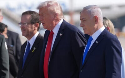 President Donald Trump (center) walks with President Isaac Herzog (left), and Prime Minister Benjamin Netanyahu at Ben Gurion Airport, October 13, 2025, near Tel Aviv. (AP/Evan Vucci)