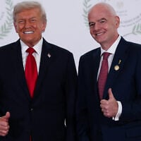 US President Donald Trump and FIFA president Gianni Infantino pose for a photo in Sharm el-Sheikh, Egypt, October 13, 2025. (Suzanne Plunkett, Pool Photo via AP)