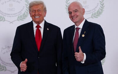 US President Donald Trump and FIFA president Gianni Infantino pose for a photo in Sharm el-Sheikh, Egypt, October 13, 2025. (Suzanne Plunkett, Pool Photo via AP)