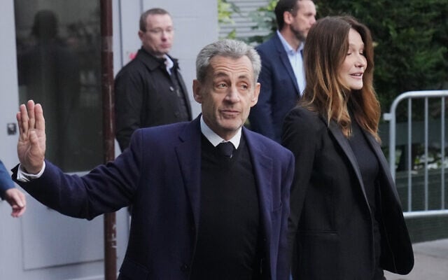 Former French President Nicolas Sarkozy and his wife Carla Bruni-Sarkozy leave their home, Oct. 21, 2025 in Paris as Nicolas Sarkozy heads to prison to serve time for a criminal conspiracy to finance his 2007 election campaign with funds from Libya. (AP Photo/Thibault Camus) Former French President Nicolas Sarkozy and his wife Carla Bruni-Sarkozy leave their home, Oct. 21, 2025 in Paris as Nicolas Sarkozy heads to prison to serve time for a criminal conspiracy to finance his 2007 election campaign with funds from Libya. (AP Photo/Thibault Camus)