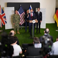 US Vice President JD Vance speaks to the media as US Special Envoy to the Middle East Steve Witkoff and Jared Kushner stand next to him, in Kiryat Gat, Israel, October 21, 2025. (AP Photo/Francisco Seco)
