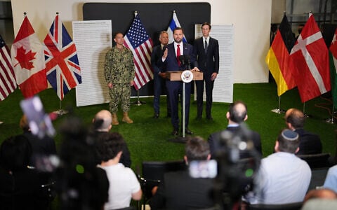 US Vice President JD Vance speaks to the media as US Special Envoy to the Middle East Steve Witkoff and Jared Kushner stand next to him, in Kiryat Gat, Israel, October 21, 2025. (AP/Francisco Seco)