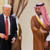 US President Donald Trump, left, arrives with Saudi Crown Prince Mohammed bin Salman for the group photo with Gulf Cooperation Council leaders during the GCC Summit in Riyadh, Saudi Arabia, May 14, 2025. (Alex Brandon/AP)