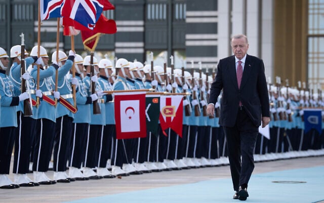 Turkish President Recep Tayyip Erdogan walks past a Guard of Honor at the Presidential Palace in Ankara, Turkey, during the visit of British Prime Minister Keir Starmer on Monday, October 27, 2025. (Stefan Rousseau/Pool Photo via AP)