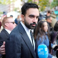 New York City mayoral candidate Zohran Mamdani talks to reporters while campaigning in New York, October 27, 2025. (AP Photo/Seth Wenig)