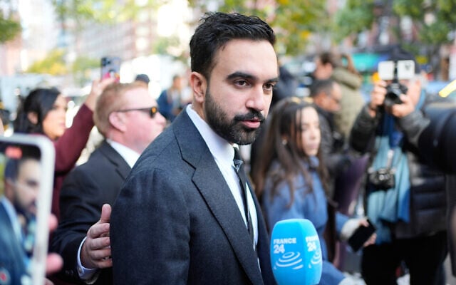 New York City mayoral candidate Zohran Mamdani talks to reporters while campaigning in New York, October 27, 2025. (AP Photo/Seth Wenig)