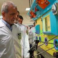 Iran's President Masoud Pezeshkian tour's the country's Atomic Energy Organization in the capital Tehran in a photo released by the agency on November 2, 2025. (Atomic Energy Organization of Iran via AP)