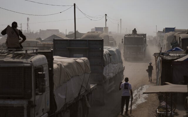Armed men guard trucks carrying aid as they drive through Khan Younis, southern Gaza Strip, November 2, 2025. (AP Photo/Jehad Alshrafi) Armed men guard trucks carrying aid as they drive through Khan Younis, southern Gaza Strip, November 2, 2025. (AP Photo/Jehad Alshrafi)