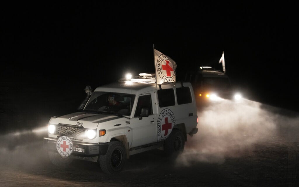 Red Cross vehicles carrying the bodies of three deceased hostages handed over by Hamas make their way toward the border crossing with Israel, in Deir al-Balah, central Gaza Strip, November 2, 2025. (AP Photo/Jehad Alshrafi) Red Cross vehicles carrying the bodies of three deceased hostages handed over by Hamas make their way toward the border crossing with Israel, in Deir al-Balah, central Gaza Strip, November 2, 2025. (AP Photo/Jehad Alshrafi)