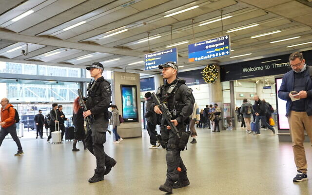 Armed police officers patrol at St Pancras International train station in London, England, November 3, 2025. (Yui Mok/PA via AP) Armed police officers patrol at St Pancras International train station in London, England, November 3, 2025. (Yui Mok/PA via AP)