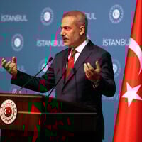 Turkish Foreign Minister Hakan Fidan talks to journalists during a news conference following a meeting about Gaza situation with his counterparts from Qatar, Jordan, Saudi Arabia, Pakistan, Indonesia and United Arab Emirates, in Istanbul, Turkey, November 3, 2015. (Khalil Hamra/AP)