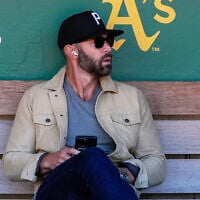 Miami Marlins assistant general manager Gabe Kapler sits in the dugout before the team's baseball game against the Oakland Athletics, May 3, 2024, in Oakland, California. (AP/Godofredo A. Vásquez, File)