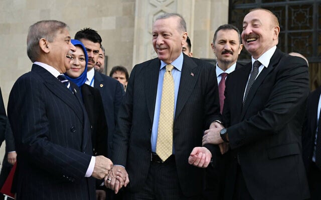 In this photo provided by Azerbaijan's Presidential Press Service, Azebaijan's President Ilham Aliyev, right, Turkey's President Recep Tayyip Erdogan, center, and Pakistan's Prime Minister Muhammad Shehbaz Sharif talk in Baku on Saturday, November 8, 2025. (Azerbaijan's Presidential Press Service via AP)