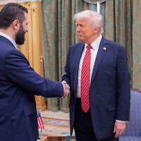 In this photo released by the Saudi Royal Palace, US President Donald Trump, right, shakes hands with Syria's President Ahmad al-Sharaa in Riyadh, Saudi Arabia, May 14, 2025. (Bandar Aljaloud/Saudi Royal Palace via AP, File)