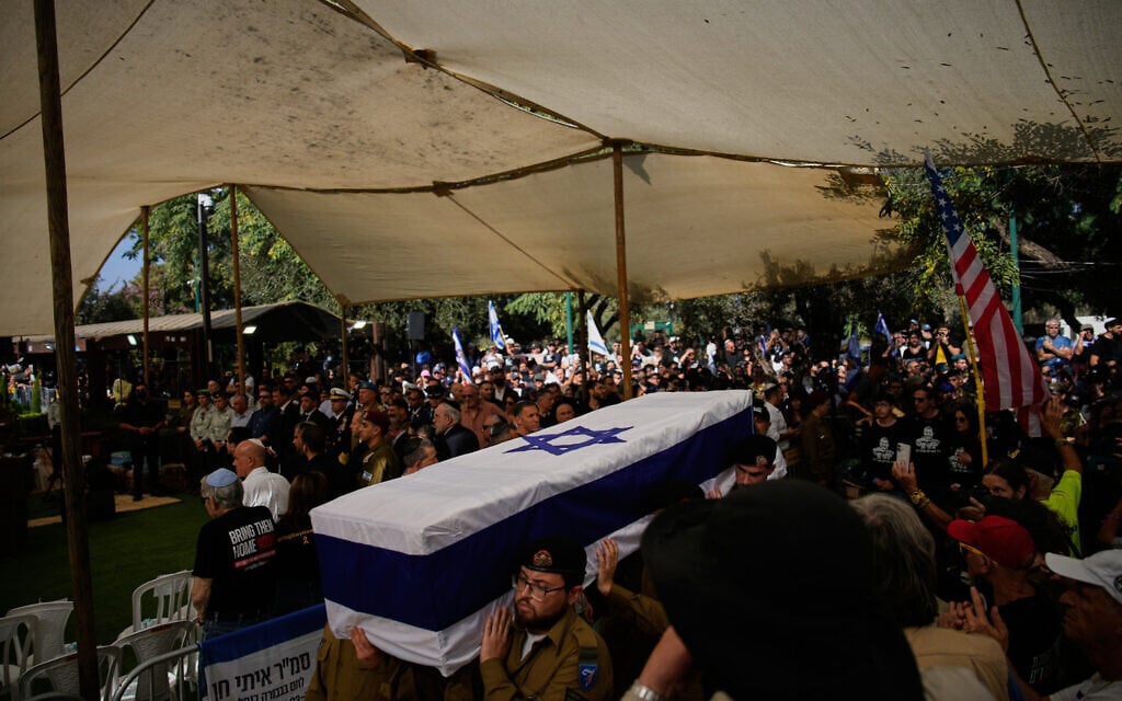 IDF soldiers carry the flag-draped coffin of slain hostage soldier Itay Chen after his body was returned from Gaza, during his funeral at Kiryat Shaul Military Cemetery in Tel Aviv, November 9, 2025. (AP Photo/Ohad Zwigenberg)